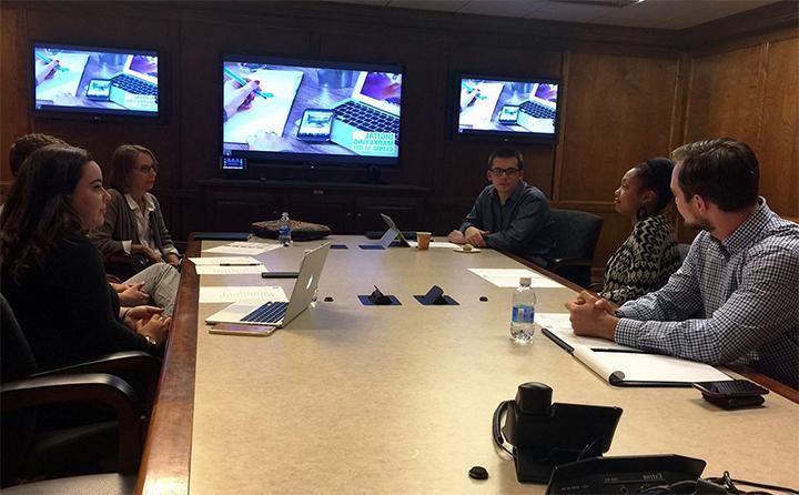 BW students pitching a digital marketing plan in a conference room